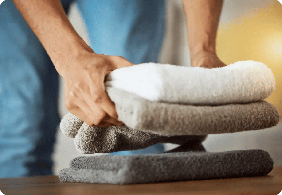 image showing a house-keeping staff doing laundry